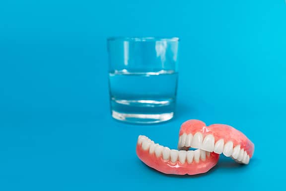 dentures and a glass of water