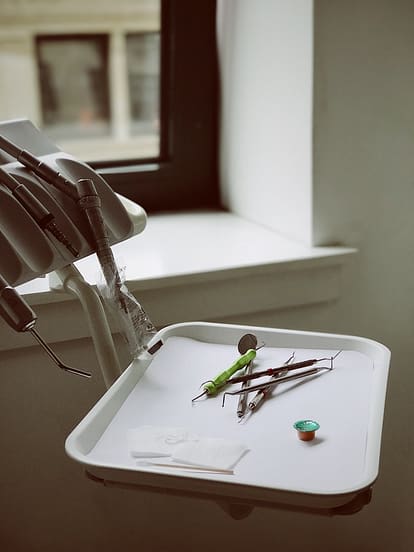 dental instruments on a white tray