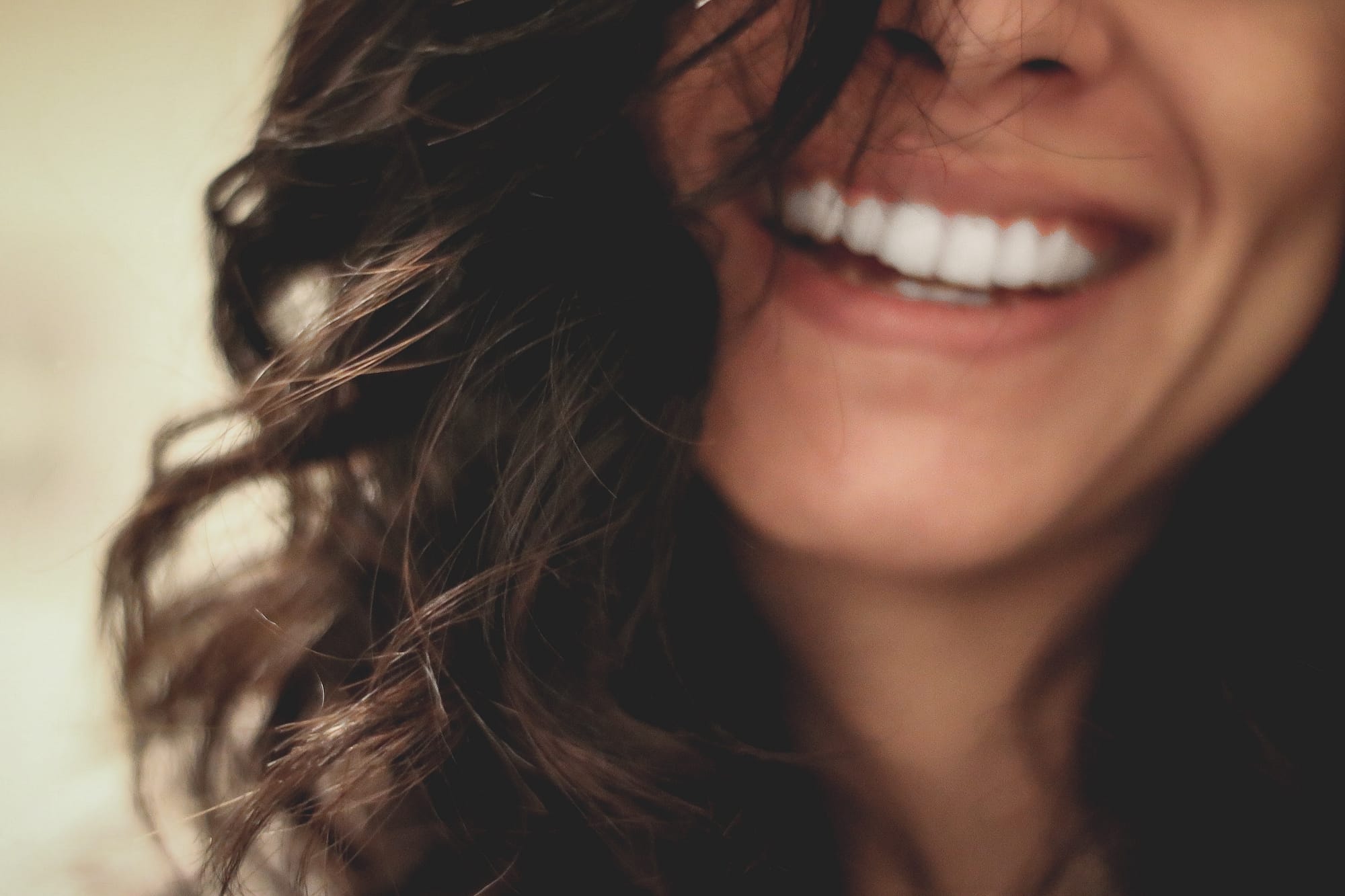 cheeful female smile with white teeth