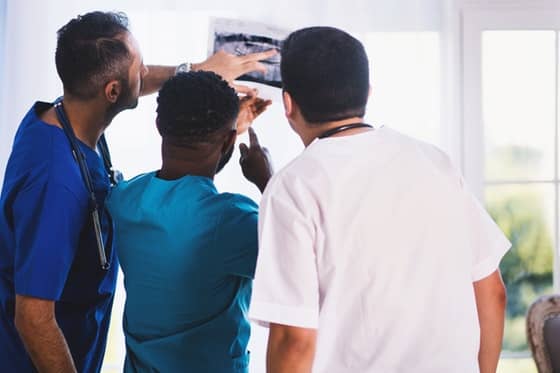dentists discussing a dental x-ray